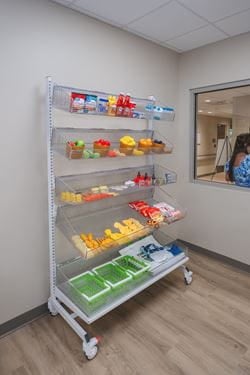 Shelving stocked with household and grocery items used during occupational therapy to help patients practice everyday living skills and home safety tasks.