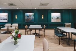 Comfortable gathering area for patients, families, and caregivers to relax, participate in activities, and receive education throughout the rehabilitation stay.