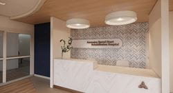 Reception desk at Ascension Sacred Heart Rehabilitation Hospital with signage behind front desk.