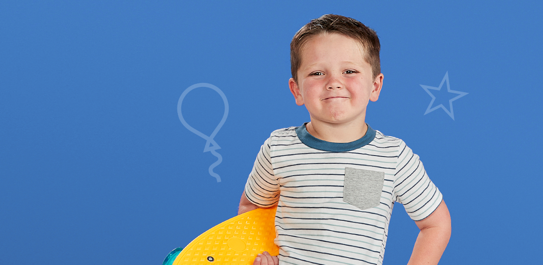 Young male patient at Studer Family Children's Hospital holding a toy.