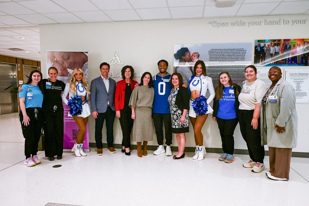Ascension St. Vincent staff and Indianapolis Colts representatives pose together at the hospital.