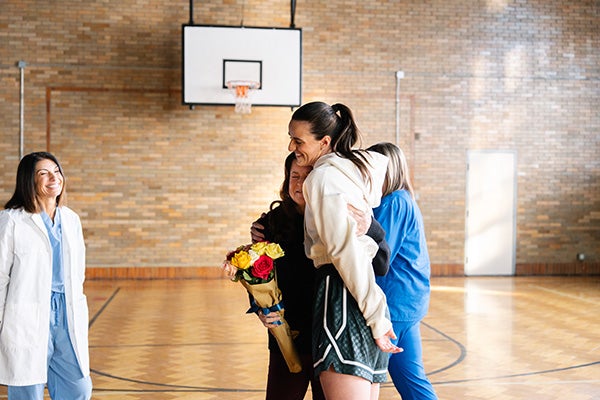 Caitlin Clark hugging Bridget.
