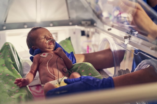 newborn baby in neonatal care unit