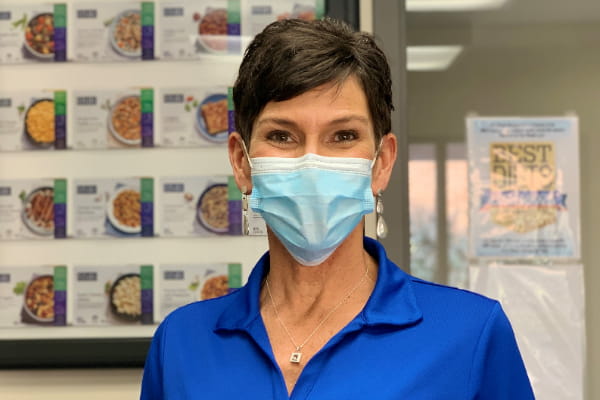 Suzanne Neville, Ascension Via Christi Weight Management educator wearing a mask and blue shirt