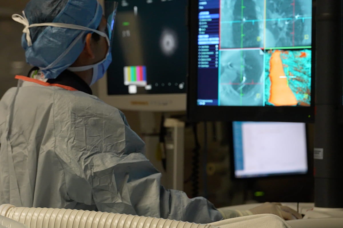 Lung specialists use robotic technology to detect and remove lung tissue for testing.