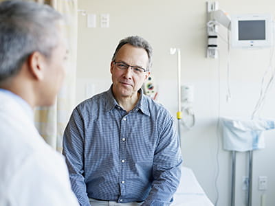 Prostate cancer patient meets with an oncologist at an Ascension site of care.