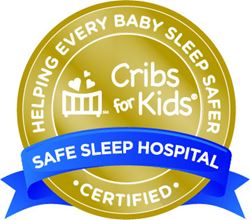 “Cribs for Kids ‘Safe Sleep Hospital Certified’ badge with a crib icon and the words ‘Helping Every Baby Sleep Safer’ in a gold and blue circular seal.”