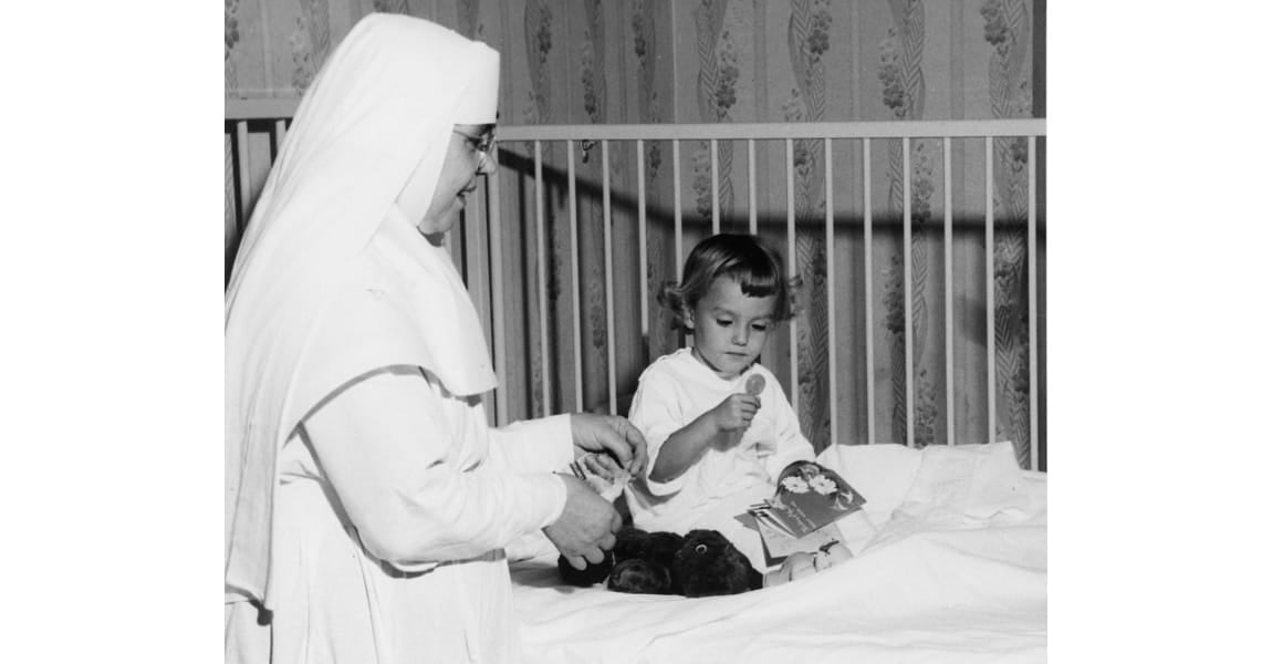 Sister taking care of a young patient in pediatrics 