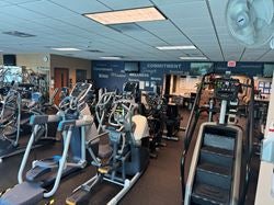 Exercise equipment at Ascension Saint Thomas Rutherford Wellness Center including stair climbers, ellipticals, and cardio machines used for supervised rehabilitation and wellness training programs.
