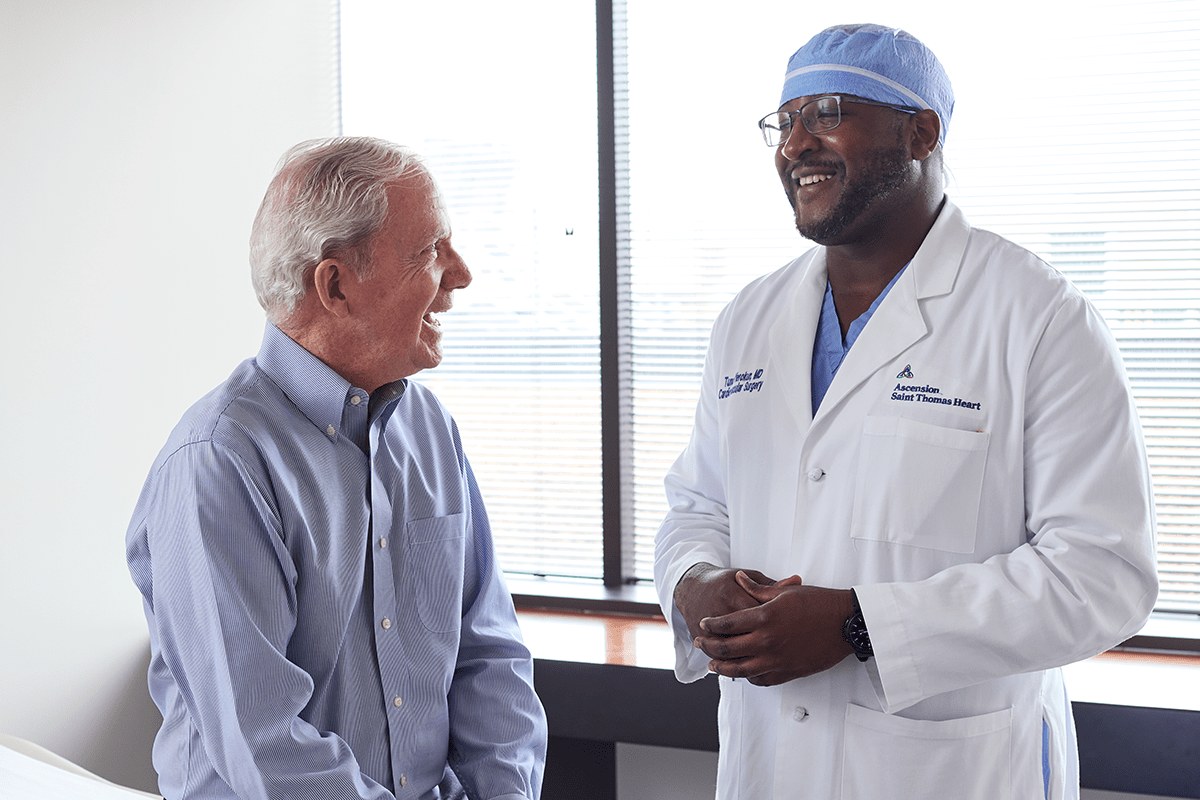Cardiothoracic surgeon Dr. Yerokun talks with a male patient at Ascension Saint Thomas Heart.