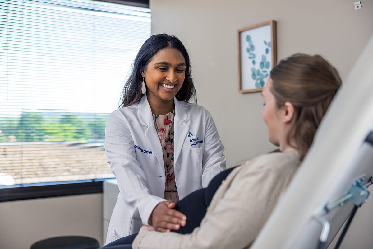 Dr. Gozmao examining a pregnant woman