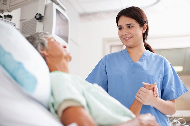 Nurse at Ascension Saint Thomas with a patient after a telestroke appointment.