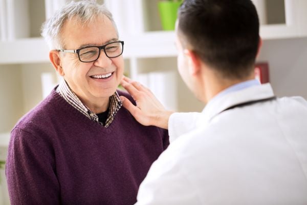 doctor talking to male patient
