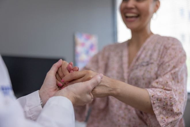 A woman holds hand with her gynecologic oncologist at Ascension Saint Thomas in Nashville, TN