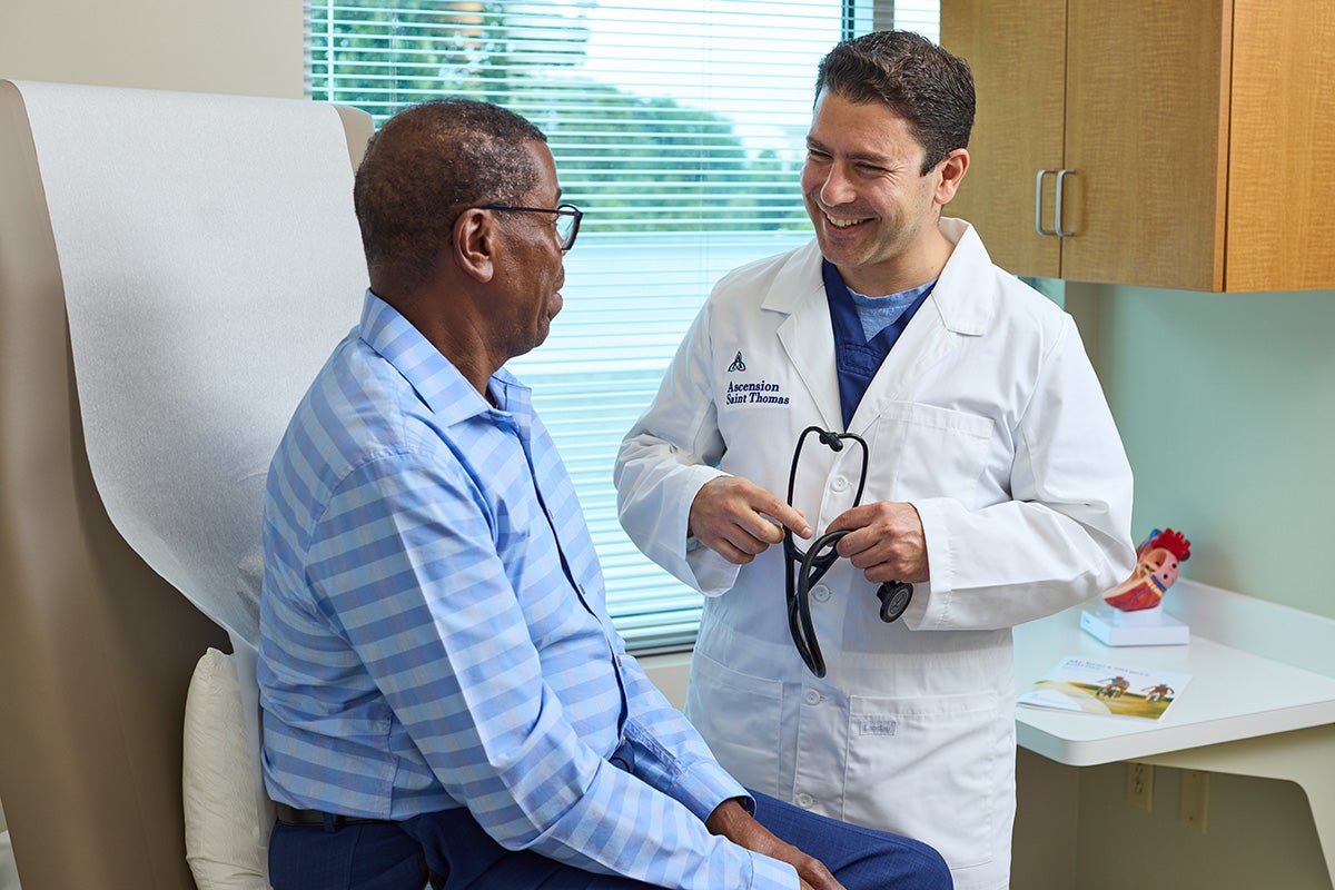 Hady Lichaa, MD talking to a patient