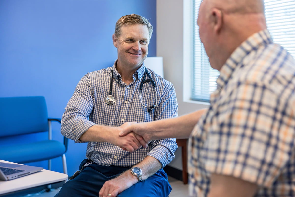 Warren Stribling, MD talking to a patient