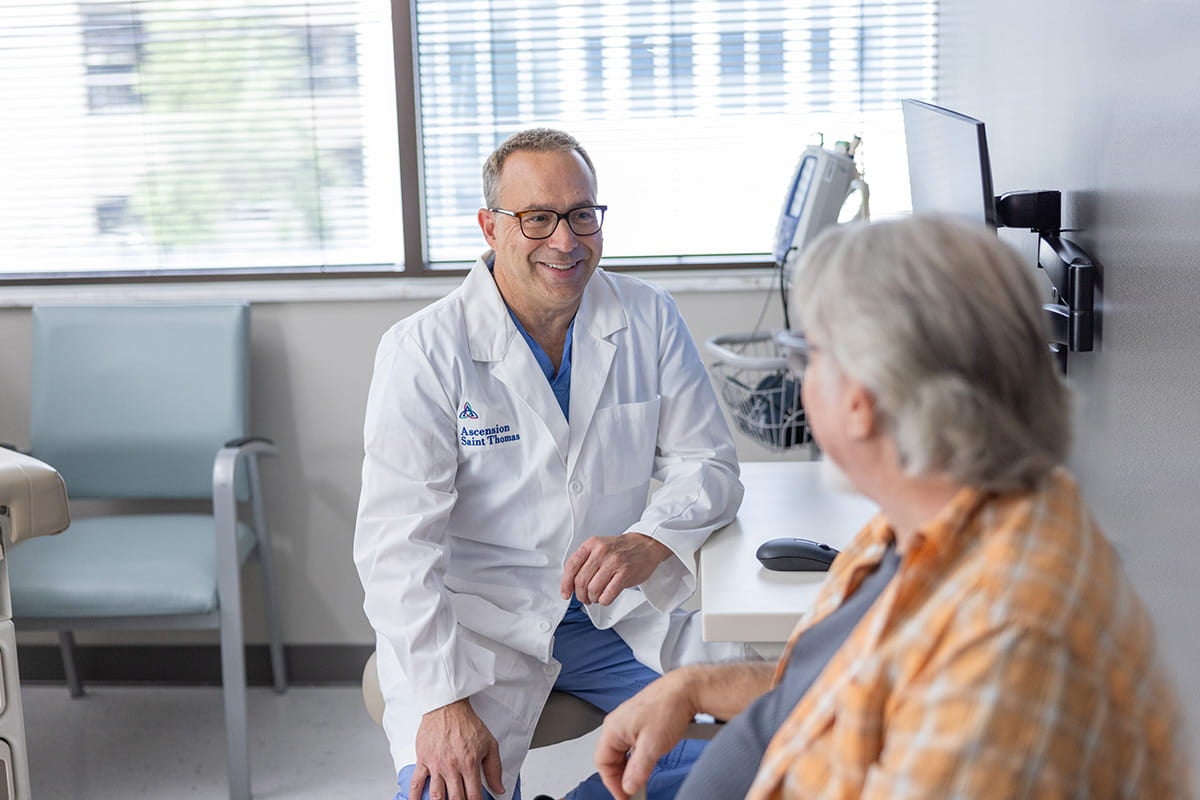 Dr. Lazar talking with a patient