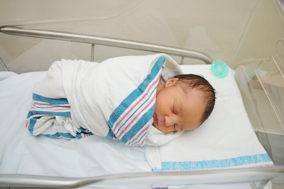 Mother with her children after receiving maternity care at Ascension Providence.