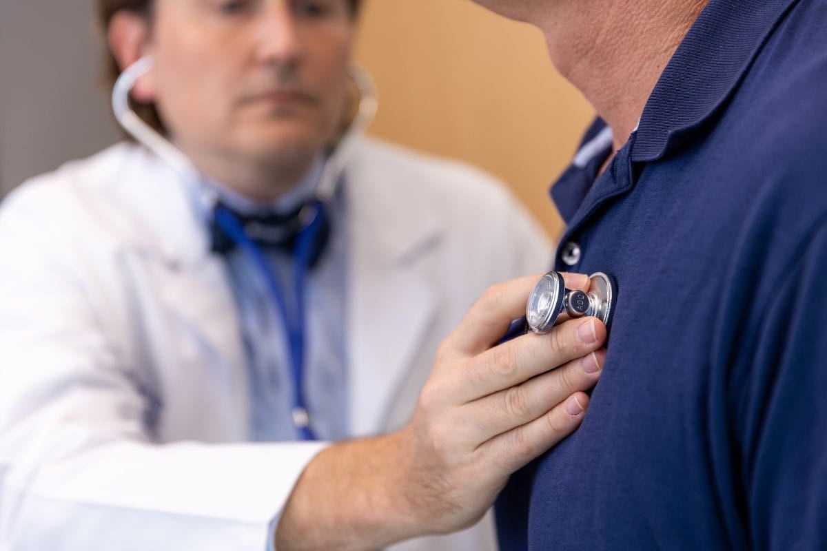 provider using stethoscope on patient