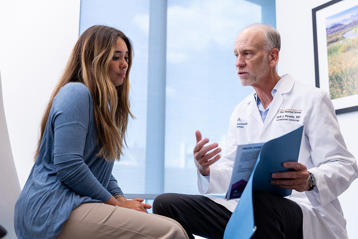 Mark Pirwitz, MD talking with a patient