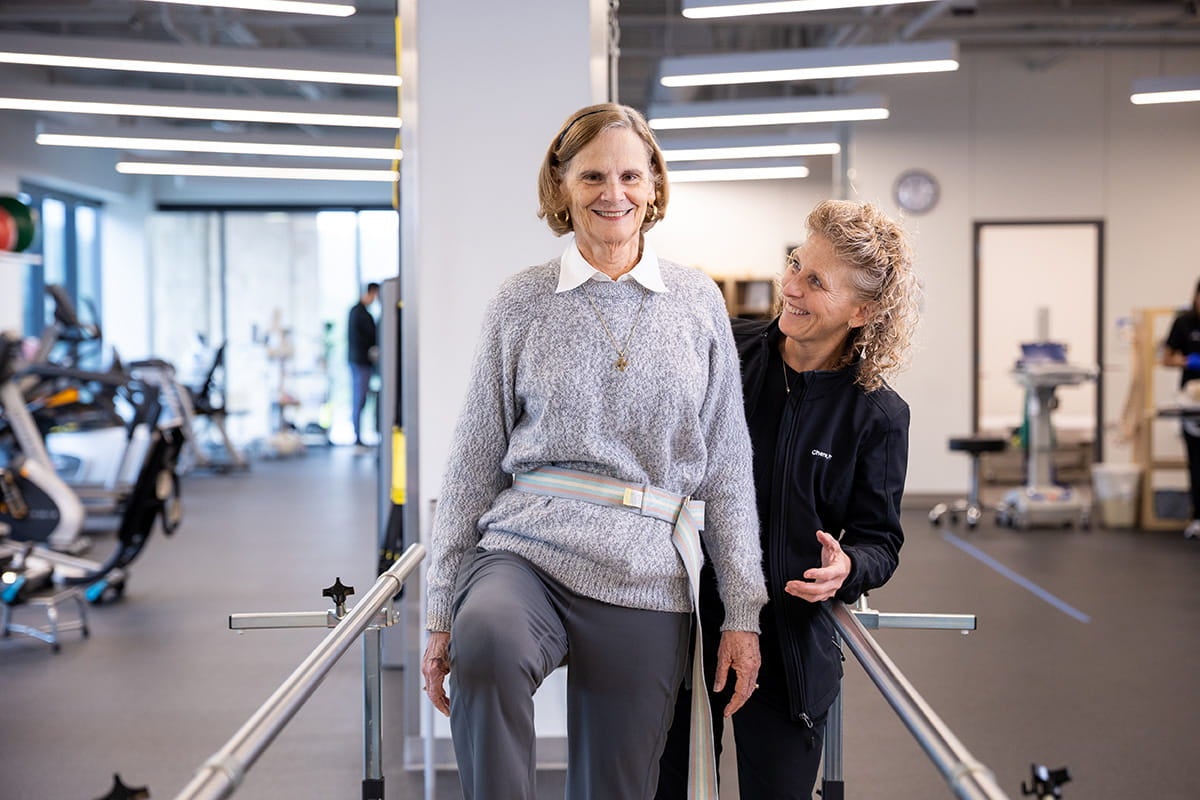 Physical therapist guides a patient through rehabilitation exercises at Ascension Texas Spine & Scoliosis