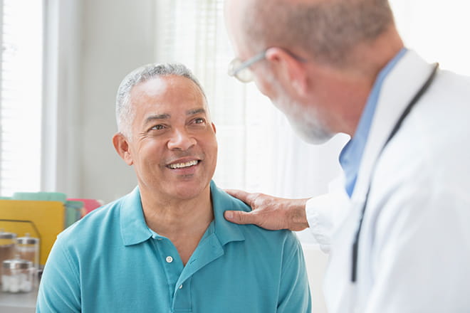 Patient discusses his colorectal cancer and liver cancer diagnoses with his doctor. 