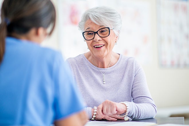 Female patient discusses her hepatobiliary disease treatment plan with her doctor. 