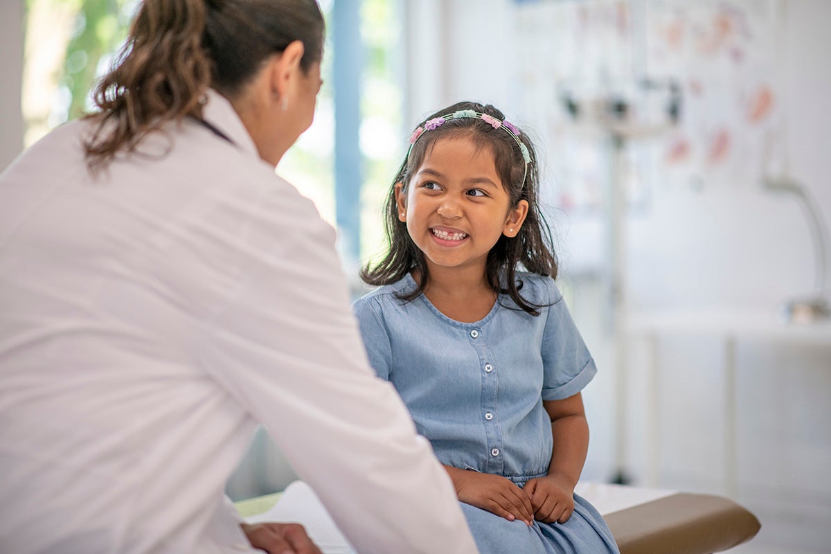 Doctor talking with a child.