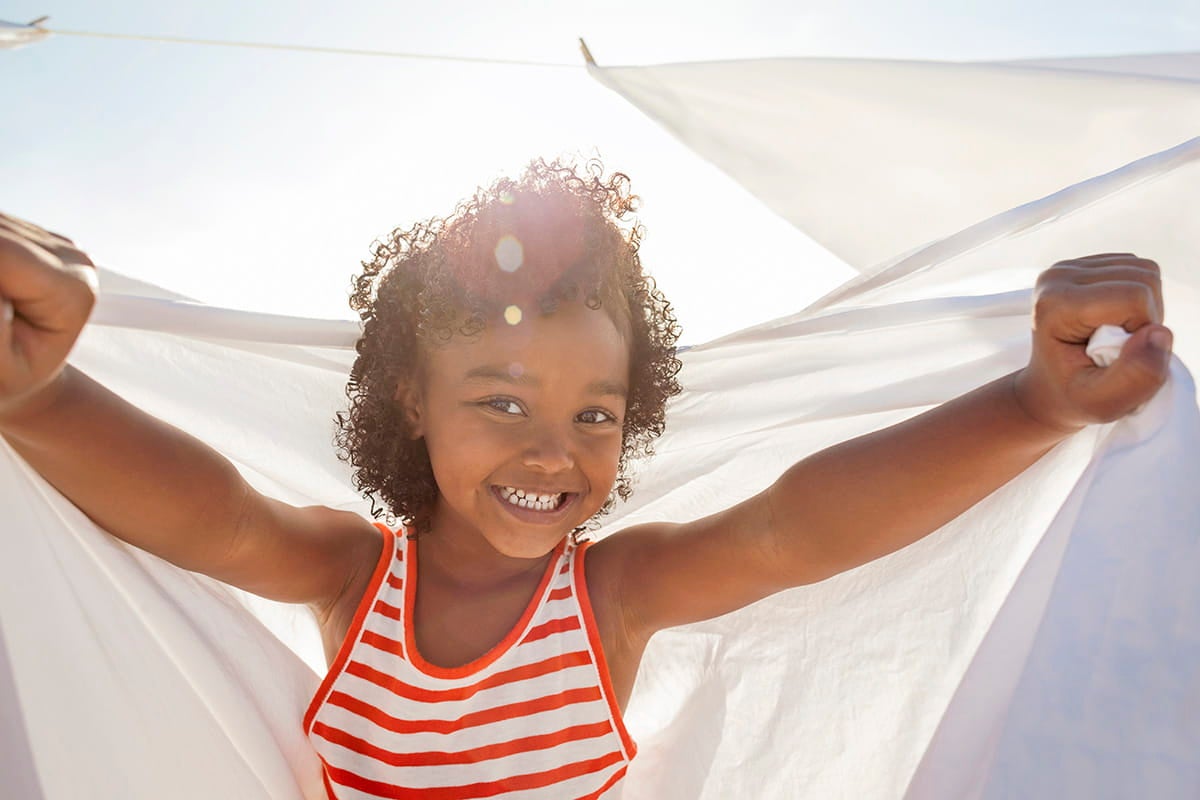 Young girl playing outside.