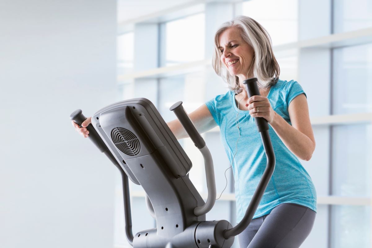 woman working out on an elliptical machine