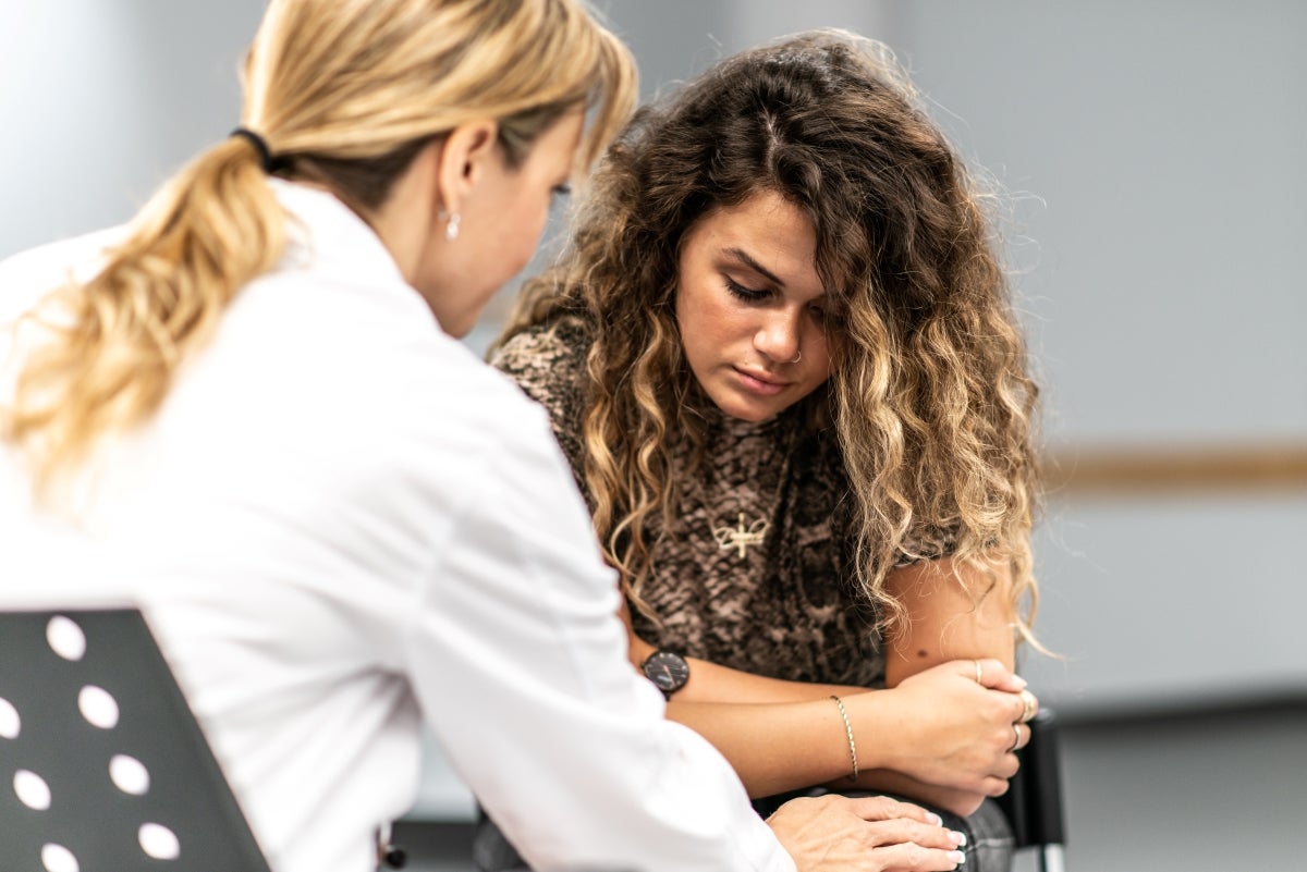 teen girl talking to a care provider
