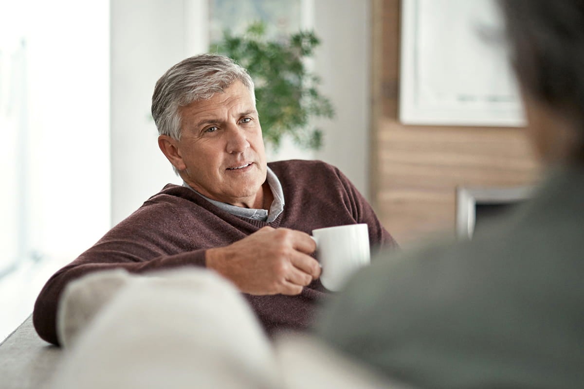 Man having coffee; specialists at Ascension deliver advanced care for brain and spine cancer.