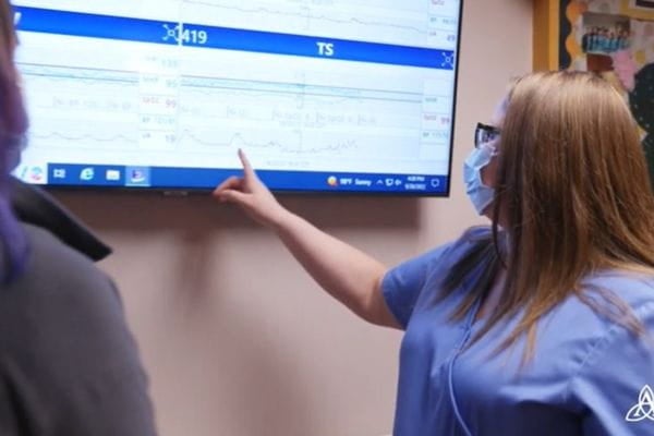 Sarah Wine, RN, reviewing a patient chart