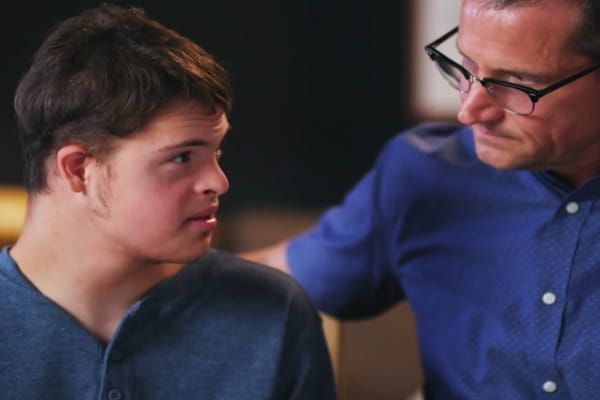 Liam sitting next to his father