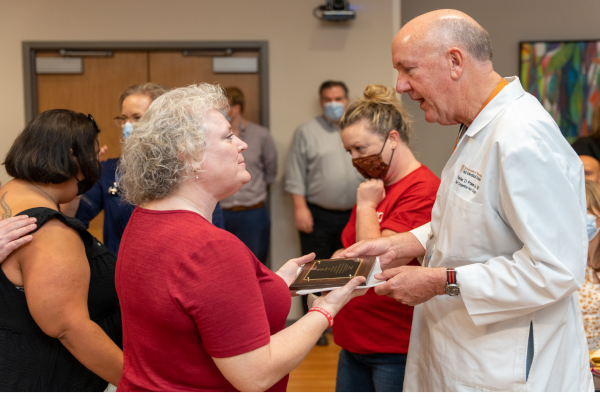 Dr. Charles Fraser Pediatric Heart Surgeon at Dell Children's Medical Center talking to woman