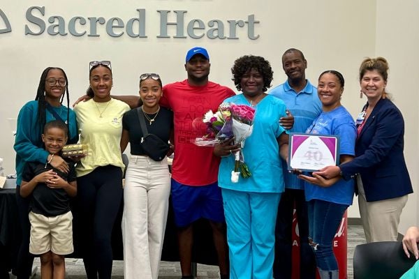 Bobbie Gray and her family pose at Ascension Sacred Heart