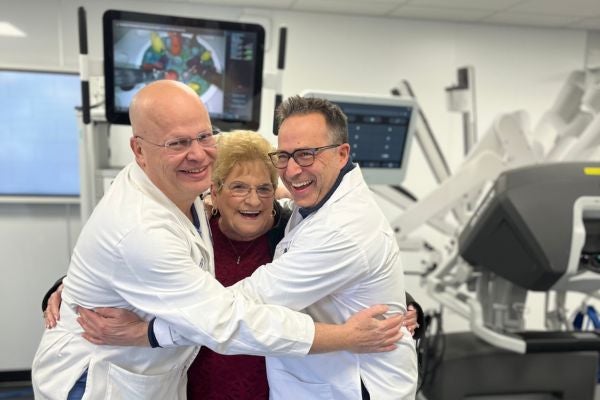 A Middle Tennessee woman hugs her surgeons after a successful Ion robotic navigation bronchoscopy and surgical resection procedure.