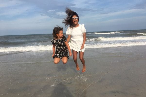 Mother and Daughter playing on the beach