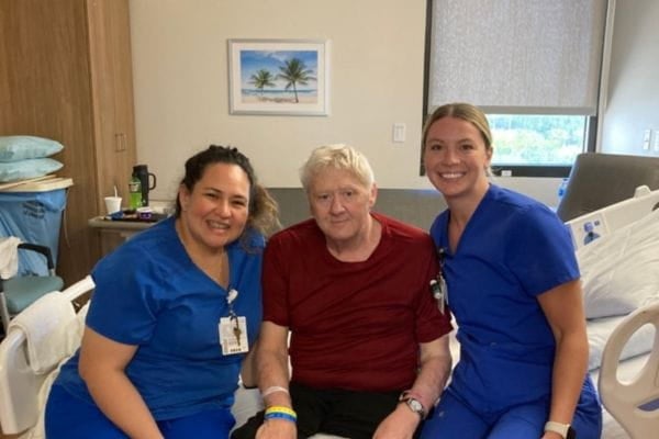 William sits with two of his caregivers at Ascension St. Vincent’s Southside Inpatient Rehabilitation Facility in Jacksonville, Florida