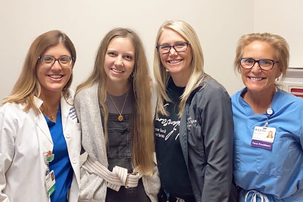 Dr, Maria Toledo poses with her patients.