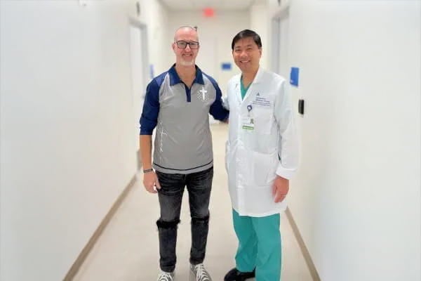 Left to right: Patient Chad S. with Dr. Patrick Gatmaitan