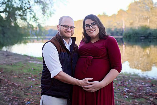 Ben and Sara of Ozark, Alabama, take a maternity photo while Sara is pregnant with 3 triplets