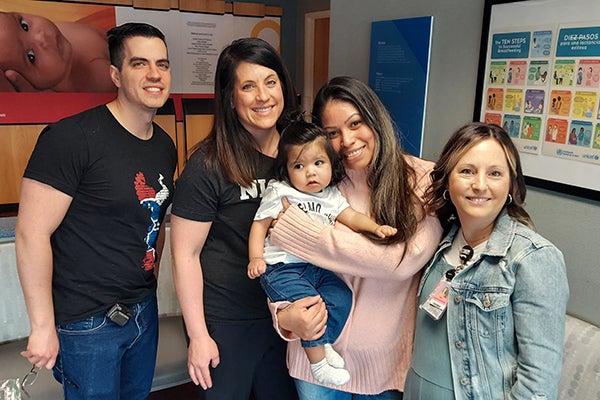 Mayra Gutierrez and her son, Isaac, at center, reunite with members of their Via Christi care team, from left, Dr. Jonathan Scrafford, Becky Hopper, and Anna Sewell.