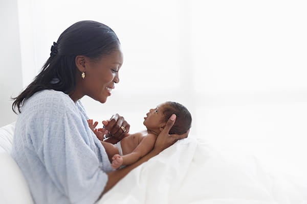 A mother holding her child.