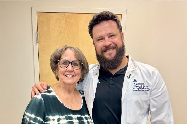 Stroke patient Nancy and Dr. Charles Schutt, a vascular neurologist, at Ascension Sacred Heart in Pensacola, Florida.