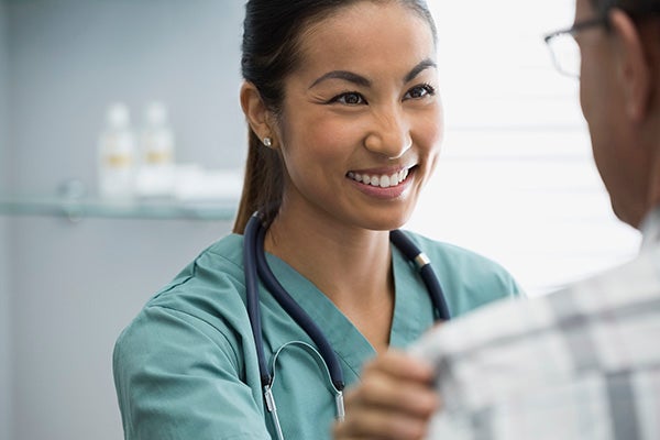 A nurse talking with a patient