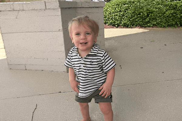 Elijah smiles brightly while celebrating progress in his craniofacial care journey at Studer Family Children’s Hospital.
