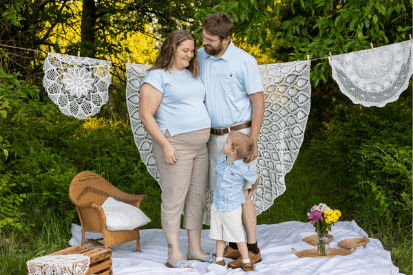 Jonnie and AJ VanKleeck stand with their son, Elias