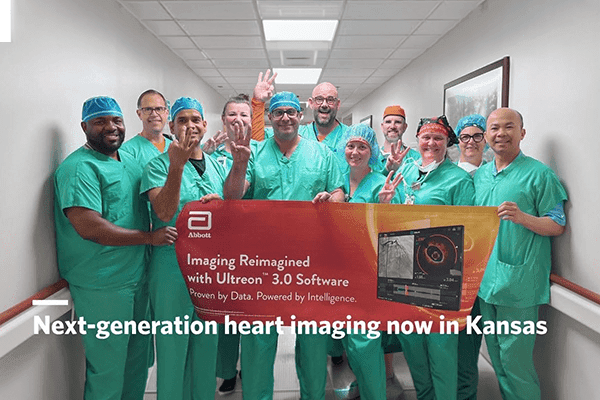 Via Christi’s heart surgery team stands with a banner promoting the Ultreon 3.0 Software.