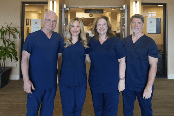Four family medicine clinicians from the same family standing together at Ascension Medical Group Providence at Sanger in Waco, Texas.